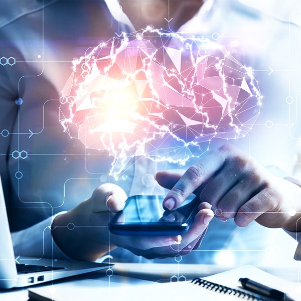 Abstract Brain And Circuit Diagram In Front Of Mobile Phone And Desk