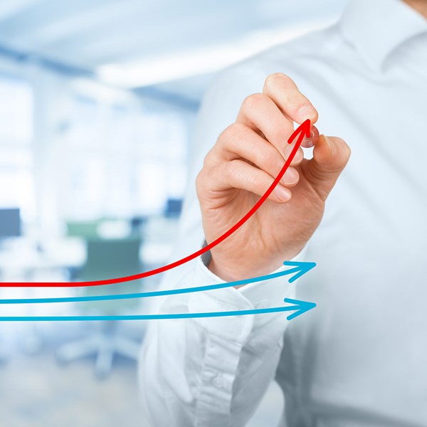 Office Worker Draws Line Graph Depicting Greater Increase